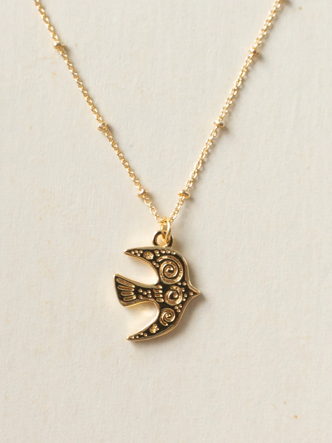 Resort Necklace, Gold - Carved Peaceful Dove